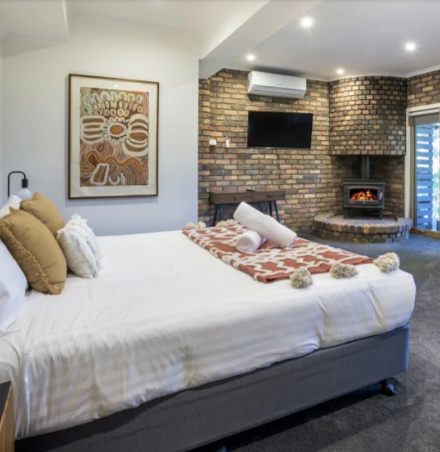 Eliot Lodge with a fire place in the bedroom