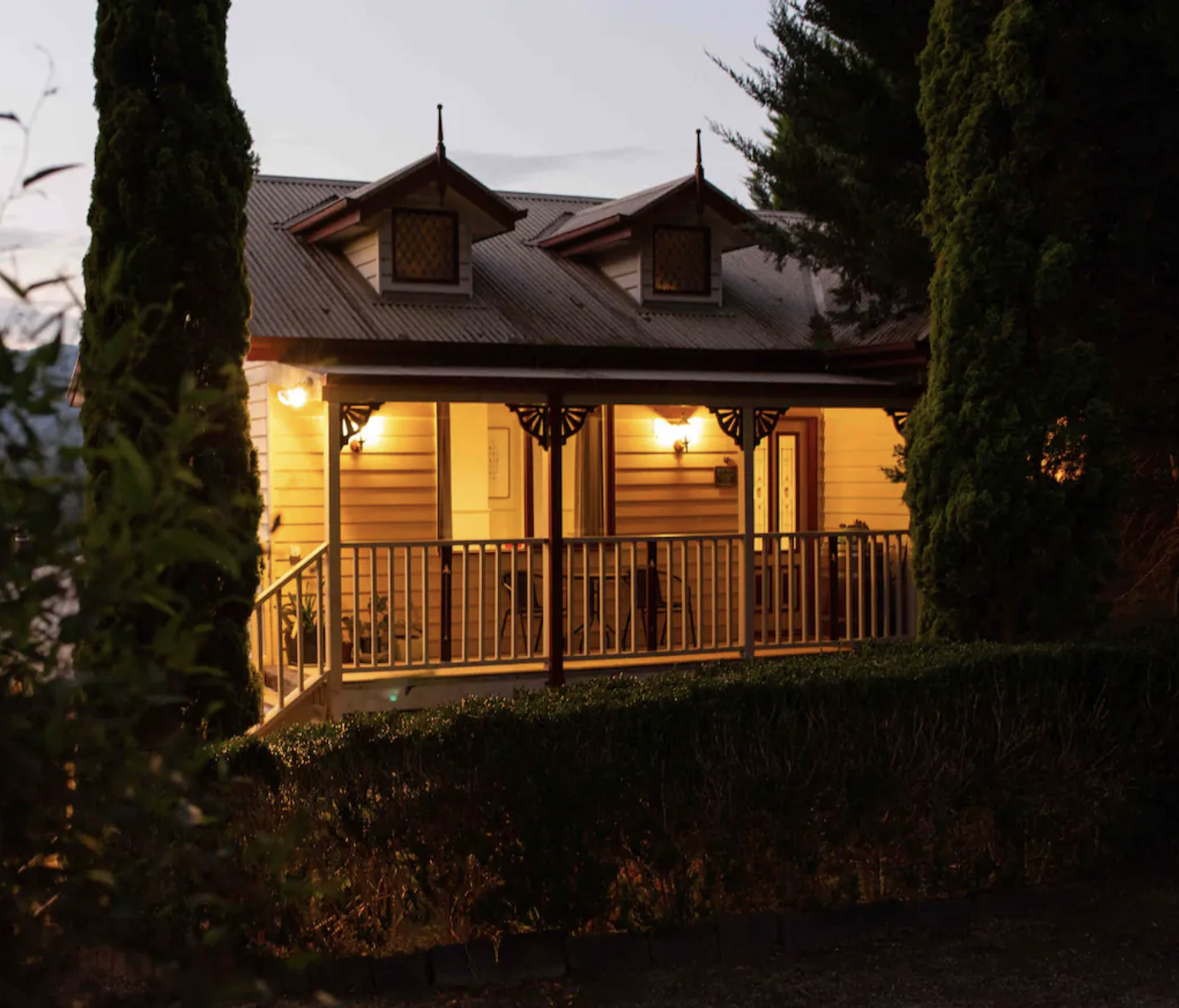 cottage with porch lights on